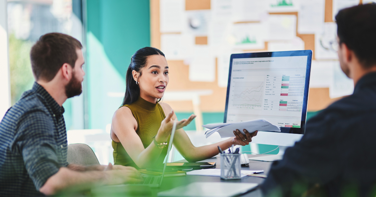 A team of business professionals discuss marketing strategies for their display ads, including targeting and retargeting.