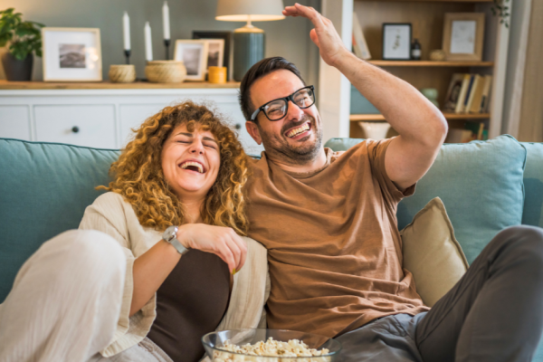 A couple watches a streaming show in their CTV device.