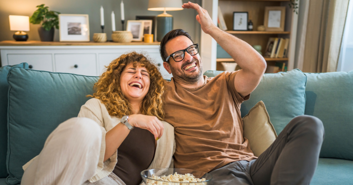 A couple watches a streaming show in their CTV device.