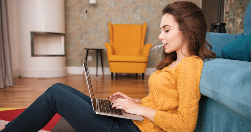 A young woman searches the Internet with a high intent to make an online purchase