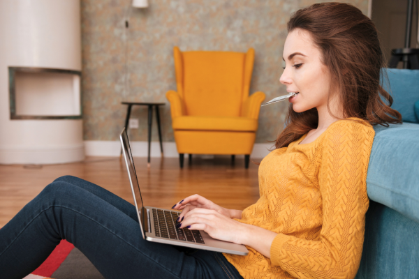 A young woman searches the Internet with a high intent to make an online purchase