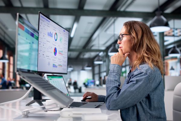 A small business owner checks in on her analytics platforms while exploring GA4 alternatives.