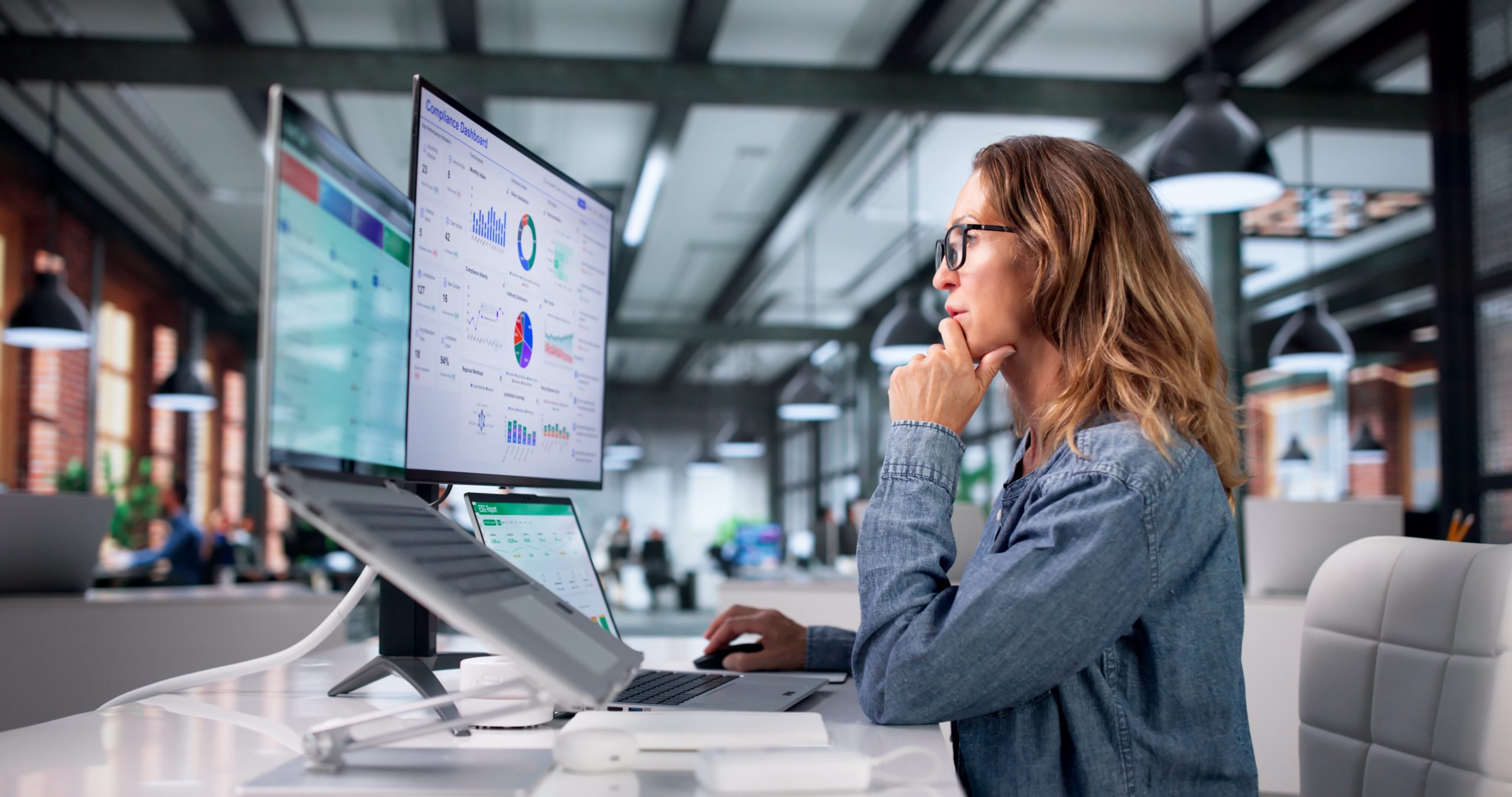 A small business owner checks in on her analytics platforms while exploring GA4 alternatives.