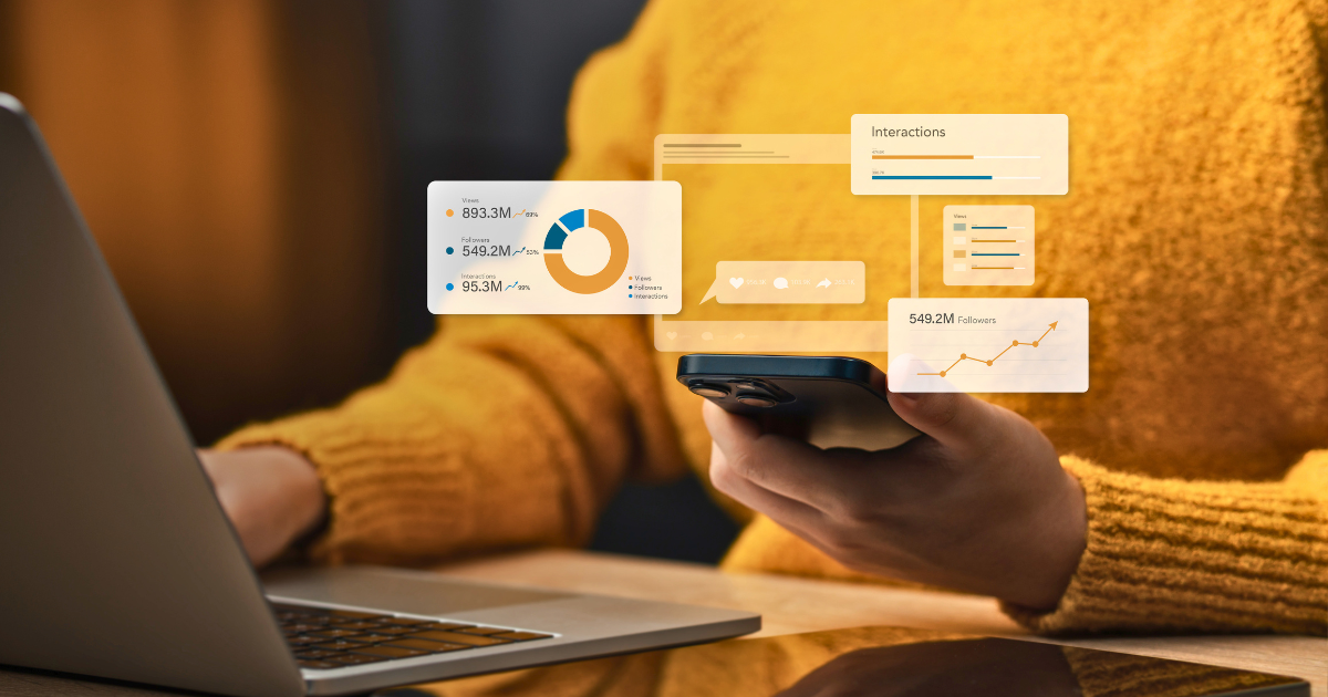 Woman in yellow shirt analyzing marketing metrics on laptop and mobile device