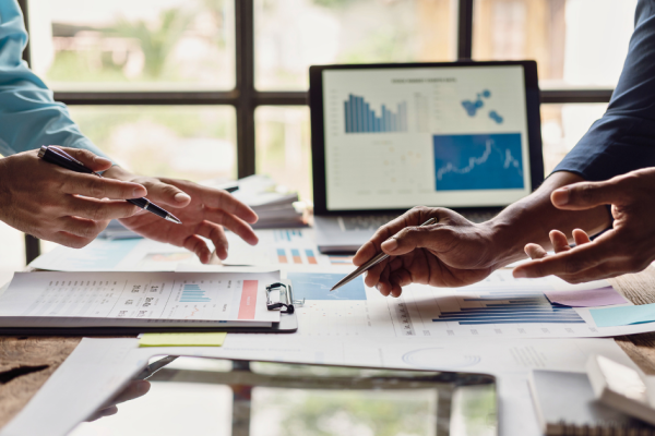 Two business people discuss the how their marketing budget allocation for 2027.